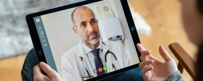 Patient Having Virtual Consultation with Doctor on Tablet