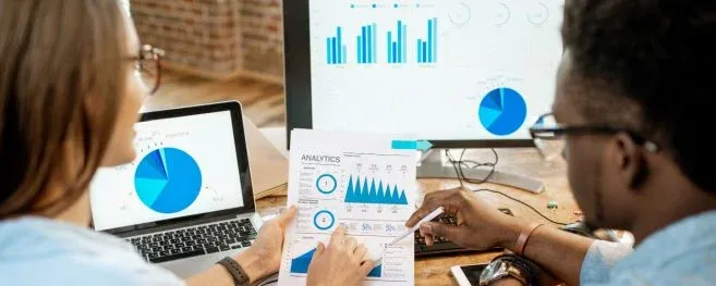 Two Persons Analyzing Call Center Data