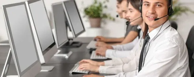 Customer Service Team at Computers with Headsets