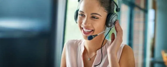 Smiling Call Center Agent With A Headset
