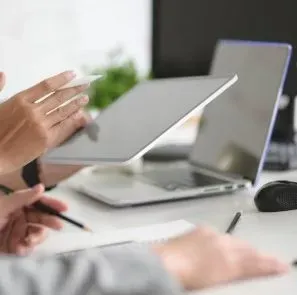A Person Holding A Tablet