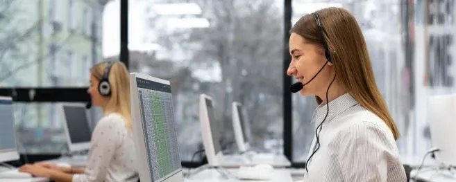 Customer Service Representative Working at Desk with Headset
