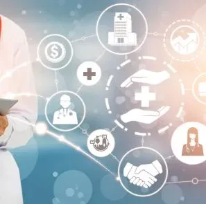 A Doctor Holding A Tablet