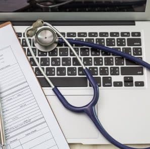 Stethoscope, Laptop And Paper