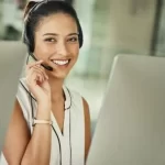 A Woman At A Call Center Answering A Call